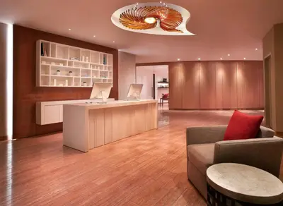 a lobby with a desk and a couch and a table at Grand Hyatt Residence in Dubai