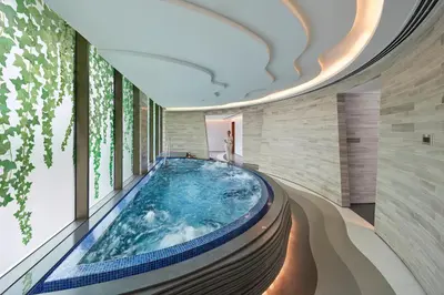 a swimming pool in a building with a ceiling at Mandarin Oriental Jumeira, Dubai in Dubai