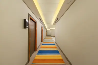 a corridor with a colorful carpet in a hallway at Citymax Hotel Al Barsha in Dubai