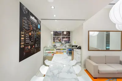 a room with a bar with a couch and a counter at Citymax Hotel Al Barsha in Dubai