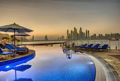 a swimming pool with a view of the city at Oceana Residences, Free beach & pool access in Dubai
