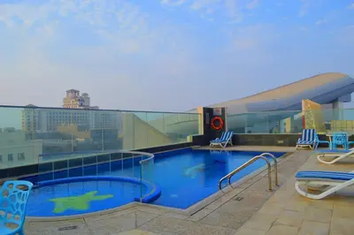 a large swimming pool on top of a building at Tulip Al Barsha Hotel Apartment in Dubai
