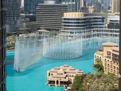 a view of a large pool of water in a city at Ultimate Stay 2BR: Burj Khalifa and fountain view in Dubai