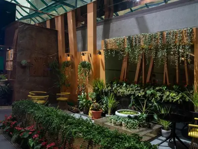 a greenhouse filled with plants and flowers at Al Khoory Executive Hotel, Al Wasl in Dubai