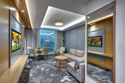 a living room with a couch and a table at The S Hotel Al Barsha in Dubai