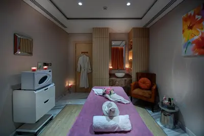 a small room with a bed and a bathroom at The S Hotel Al Barsha in Dubai