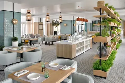 a rendering of a restaurant with tables and chairs at Vida Emirates Hills in Dubai