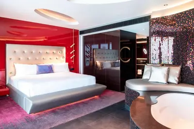 a bedroom with a bed and a tub and a sink at W Dubai - The Palm in Dubai