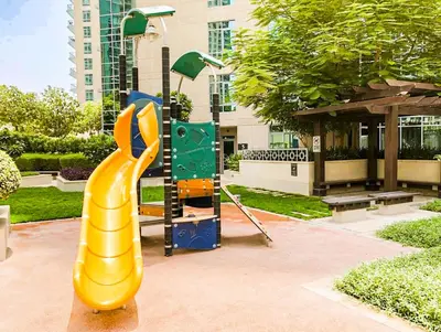 a playground with a slide in a park at Elite Royal Apartment | Burj Residences Tower 5 | Gold in Dubai