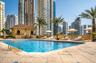 a swimming pool in a city with tall buildings at SUHA JBR Hotel Apartments in Dubai