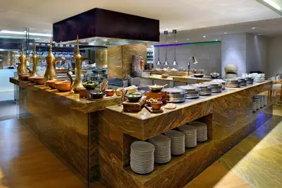 a kitchen with a counter with dishes on it at JW Marriott Marquis Hotel Dubai in Dubai