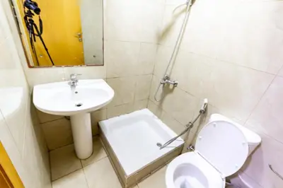 a bathroom with a toilet and a sink at Budget Rooms With Private Bathroom for 'girls' only in Dubai, Marina in Dubai