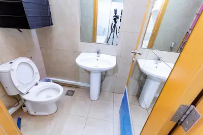 a bathroom with a toilet and a sink at Budget Rooms With Private Bathroom for 'girls' only in Dubai, Marina in Dubai