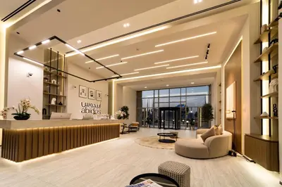 a lobby of a store with a waiting area at Abidos Hotel Apartment Dubai Land in Dubai
