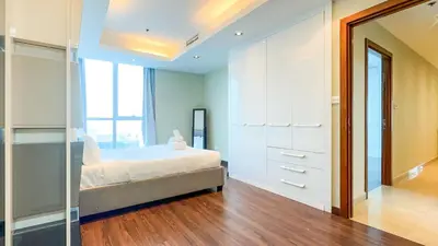 a bedroom with a bed and a large mirror at Luton Vacation Homes - The Marina Torch - Sea view - 64AB07 in Dubai