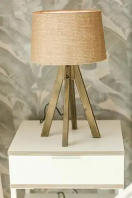 a lamp on top of a white table at Prime Retreats - Downtown Dubai in Dubai