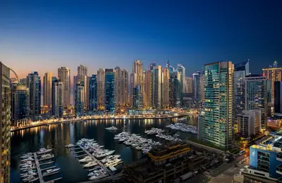 a view of a city with boats in a harbor at Millennium Place Dubai Marina in Dubai