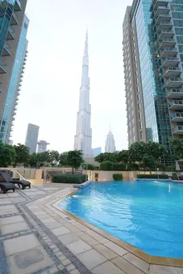 a swimming pool in the middle of a city with buildings at Elite Royal Apartment - Full Burj Khalifa & Fountain View - Royal in Dubai