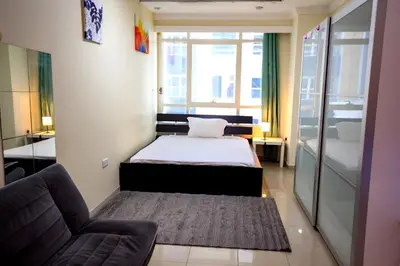 a small room with a bed and a couch at comfortable Rooms For Girls in Marina Dubai, the best offer in Dubai