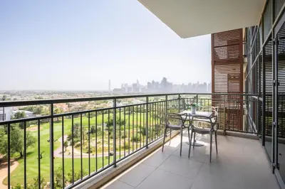 a balcony with a table and chairs and a view at New Arabian -Panorama 2 BR Full Golf course View in Dubai