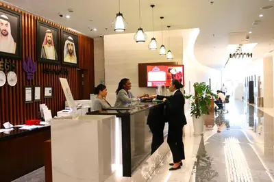 three women standing at a counter in a store at Park Regis Business Bay in Dubai