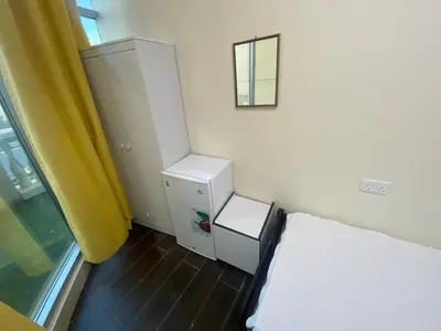 a small room with a bed and a window at Nice Single Rooms for 