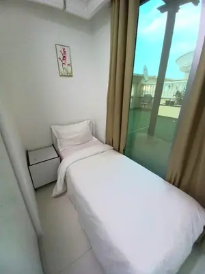 a small bedroom with a bed and a window at Nice Single Rooms for 