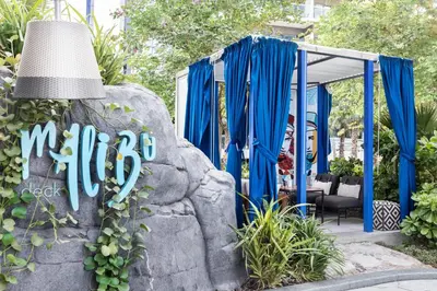 a sign for a mitzvah in a garden at Paramount Hotel Dubai in Dubai