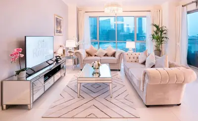 a living room with a couch and a tv at Elite Royal Apartment - Full Burj Khalifa & Fountain View - 2 bedrooms and 1 open bedroom without partition in Dubai