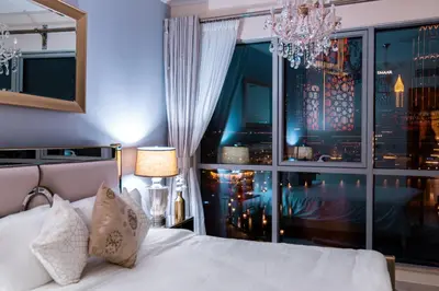 a bedroom with a bed and a large window at Elite Royal Apartment - Full Burj Khalifa & Fountain View - 2 bedrooms and 1 open bedroom without partition in Dubai