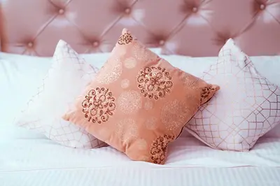 a group of pillows sitting on top of a bed at Elite Royal Apartment - Full Burj Khalifa & Fountain View - Deluxe in Dubai
