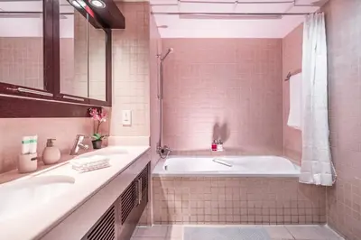 a bathroom with a tub and a sink at Elite Royal Apartment - Full Burj Khalifa & Fountain View - Deluxe in Dubai