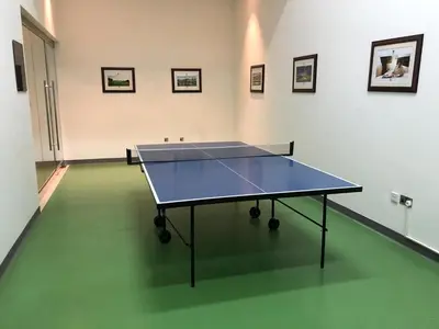 a ping pong table in the middle of a room at Elite Royal Apartment - Full Burj Khalifa & Fountain View - Deluxe in Dubai
