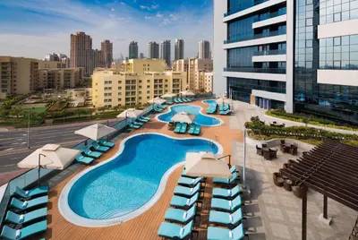 an overhead view of a pool on top of a building at Millennium Place Barsha Heights Hotel Apartments in Dubai