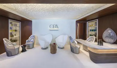 a room with a group of chairs and a table at Andaz Dubai The Palm, By Hyatt in Dubai