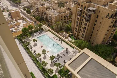 an overhead view of a swimming pool in a city at Maison Privee - Elevated Living with Spectacular Burj Khalifa Views in Dubai