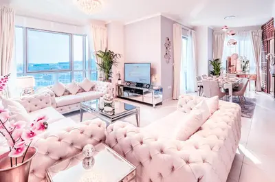 a living room with white furniture and large windows at Elite Royal Apartment - Full Burj Khalifa and Fountain View - Caesar in Dubai
