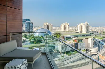 a balcony with a view of a city at Andaz Family Suites by Hyatt- Palm Jumeirah in Dubai
