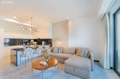 a living room with a couch and a table at JW Marriott Full Marina View, Luxury Suites by Gardenia with Direct Access to Marina Mall in Dubai