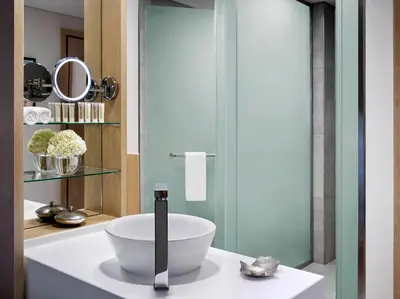 a bathroom with a bowl sink on a counter at Avani Ibn Battuta Dubai Hotel in Dubai