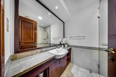 a bathroom with a sink and a mirror at Nice 2BD apartment in the Palm Jumeirah in Dubai
