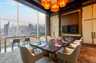 a conference room with a long table and chairs at Taj Jumeirah Lakes Towers in Dubai