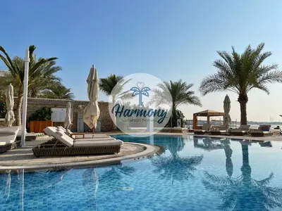 a swimming pool with a sign that says morocco at Harmony Vacation Homes - BALQIS Residence in Dubai