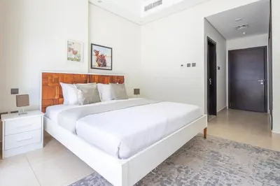a large white bedroom with a large white bed at Frank Porter - Mon Reve in Dubai