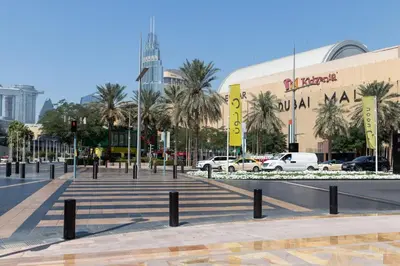 a city street with cars parked in front of a building at Frank Porter - Mon Reve in Dubai