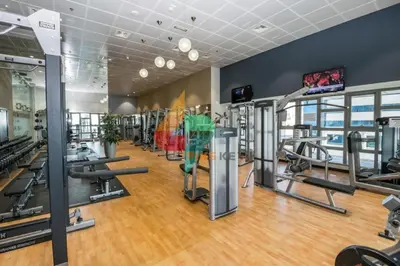 a gym with treadmills and elliptical machines at Princess Tower highest world Penthouse floor 86! in Dubai