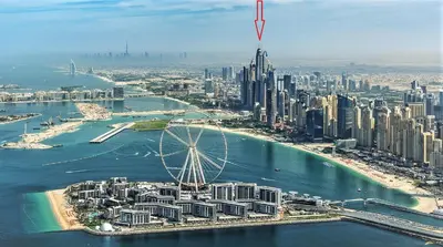 an aerial view of a city with a ferris wheel at Princess Tower highest world Penthouse floor 86! in Dubai