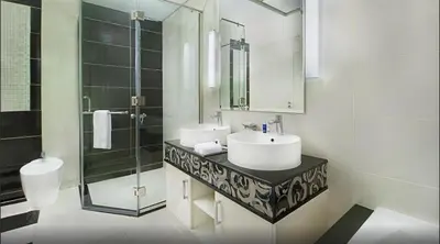 a white bathroom with a sink and a shower at HotelApart Dubai Mall st Burj Khalifa View in Dubai