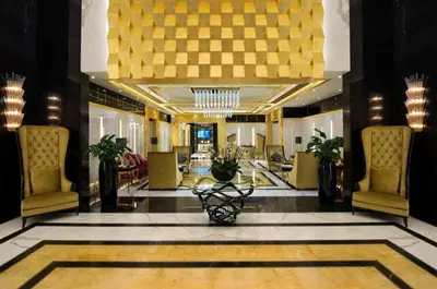 a lobby with a large lobby with chairs and a lobby at HotelApart Dubai Mall st Burj Khalifa View in Dubai