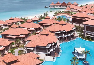 an aerial view of a resort with a swimming pool at Anantara The Palm Dubai Resort in Dubai